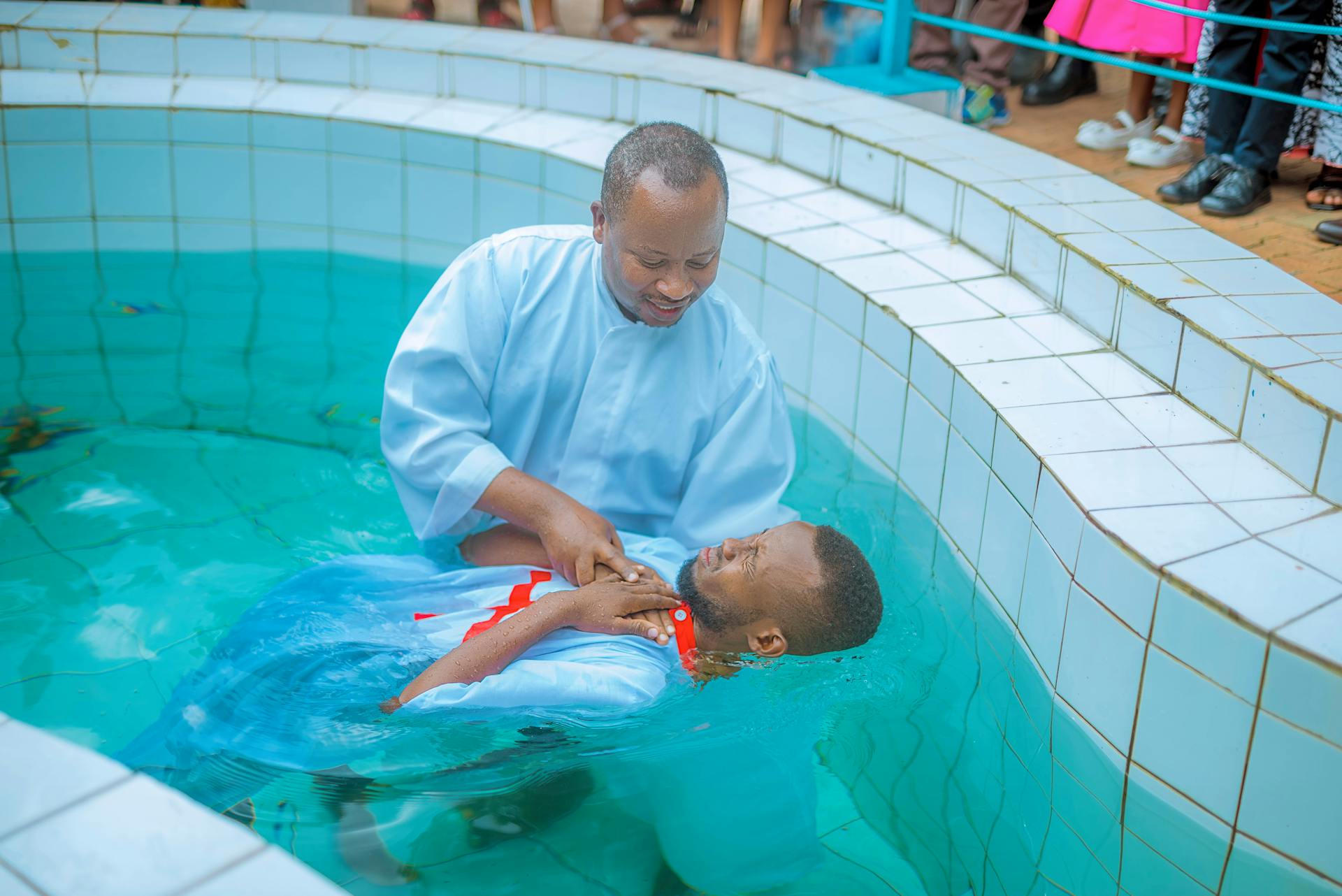 Picture of a person being baptized.